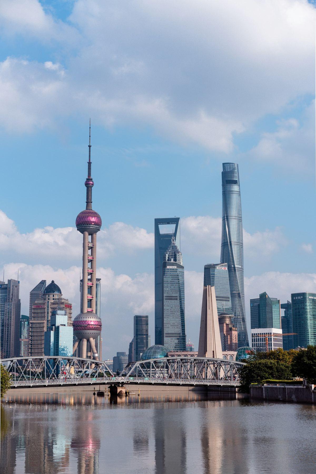 Shanghai skyline with modern towers reflected across the water